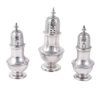 A set of three George II silver baluster casters by Francis Spilsbury I