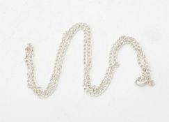 A collection of approximately 100 silver coloured curb link chains