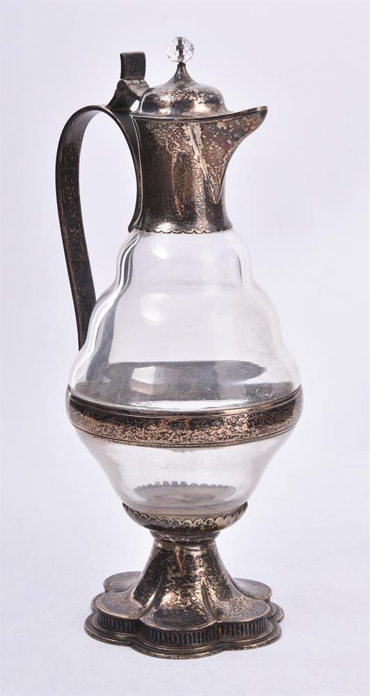 A late Victorian silver mounted clear glass Gothic Revival ewer by Carl Krall