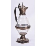 A late Victorian silver mounted clear glass Gothic Revival ewer by Carl Krall