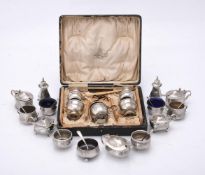 A silver five piece cruet set by Kemp Bros. of Bristol