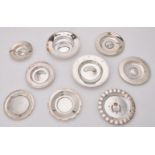 A collection of silver circular dishes