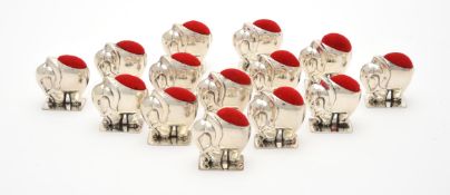 Fourteen silver mounted pin cushions