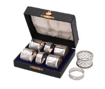 A set of six silver circular napkin rings by Henry Griffith & Sons Ltd
