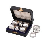 A set of six silver circular napkin rings by Henry Griffith & Sons Ltd