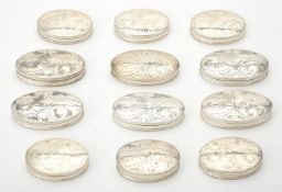 A collection of silver oval boxes