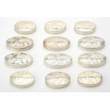 A collection of silver oval boxes