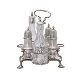 A George II silver Warwick cruet stand with associated bottles and casters