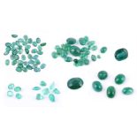 † A collection of unmounted emeralds and synthetic emeralds