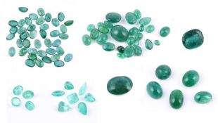 † A collection of unmounted emeralds and synthetic emeralds