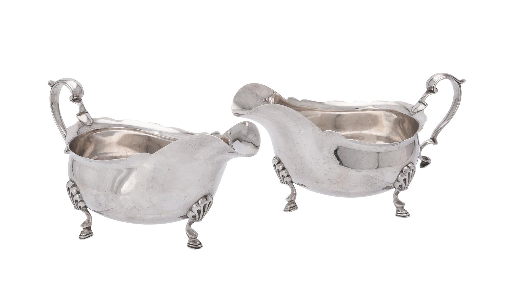 A pair of silver oval sauce boats by Elkington & Co.