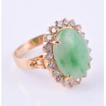 A jadeite and diamond cluster ring