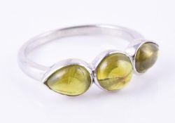 A three stone peridot ring