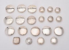 A collection of silver circular boxes