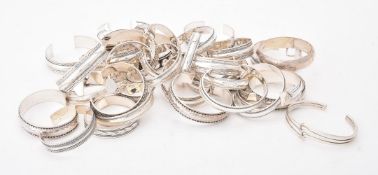 A collection of silver and silver coloured bangles