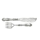 A pair of Victorian silver fish servers by Aaron Hadfield