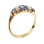 A sapphire and diamond seven stone ring