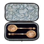 A cased pair of Victorian silver gilt spoons by Robert Stebbings