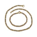 An 18 carat two colour gold necklace and bracelet