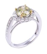 A laser drilled and fracture filled yellow diamond and diamond cluster ring