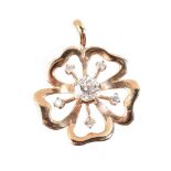 A 9 carat gold diamond flower pendant