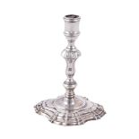 A George II cast silver taperstick by Simon Jouet
