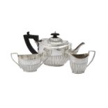 A Victorian silver oval half lobed three piece tea set by W. & G. Sissons