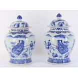 A pair of Chinese blue and white vases and covers