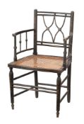 A 19th century black painted armchair