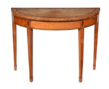 Y A George III satinwood, tulipwood crossbanded and purple heart inlaid demi-lune folding card table