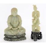 A Chinese celadon soapstone buddha and carved soapstone figure of a fisherman