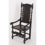 A carved oak armchair