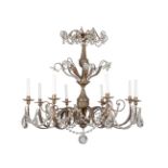 A patinated and glass eight light chandelier