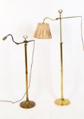 Two similar adjustable brass reading standard lamps