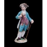 A Meissen figure of a boy with a cane