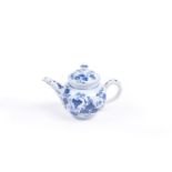 A Lowestoft small blue and white bullet-shaped 'toy' teapot and cover