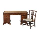 A mahogany twin pedestal desk in George III style