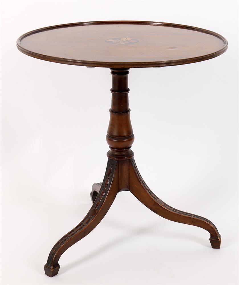 An early 19th century and later mahogany circular tripod table