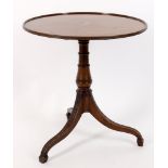 An early 19th century and later mahogany circular tripod table