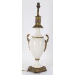 Lighting to include a converted late 19th century white bodied gilt metal mounted table lamp