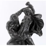 An early 20th century Danish black glazed basalt figural group of two warriors in combat