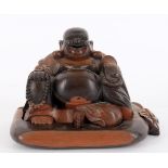 A Chinese carved wood figure of Budai