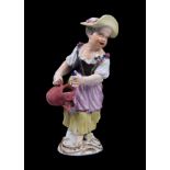 A Meissen figure of a girl with watering can