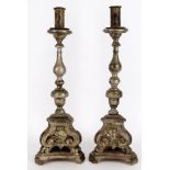 A pair of continental silver painted altar candlesticks