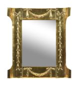 An Art Nouveau brass framed wall mirror