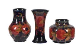 'Pomegranate' three Moorcroft pottery vases