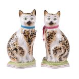 A pair of Staffordshire pottery models of cats of William Kent Ltd.