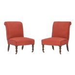A pair of stained beech and upholstered side chairs in Victorian taste