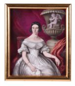 An English porcelain plaque painted with a portrait of a seated woman