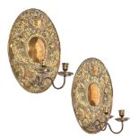 A pair of brass wall sconces